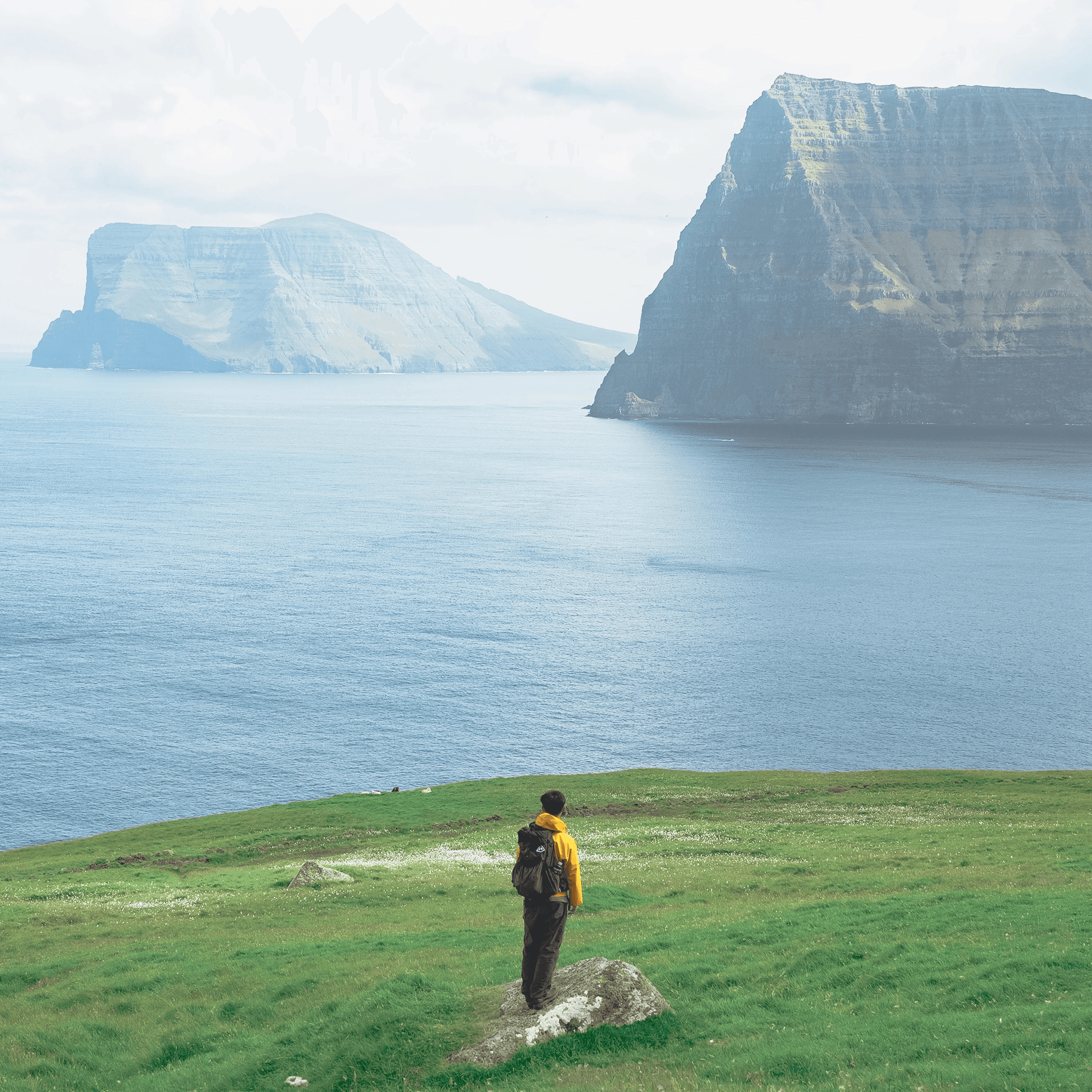 Bon standing on a cliff in the Faroe Islands